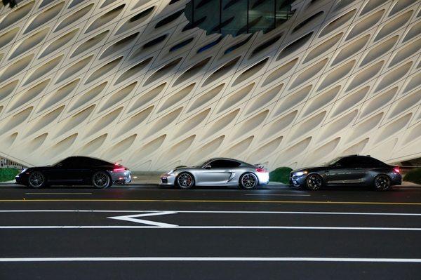 Our Porsche 911 Carrera T,  Porsche Cayman GT4, and BMW M2 lined up at The Broad in Downtown Los Angeles