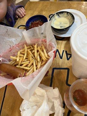 Kid's corn dog and fries.