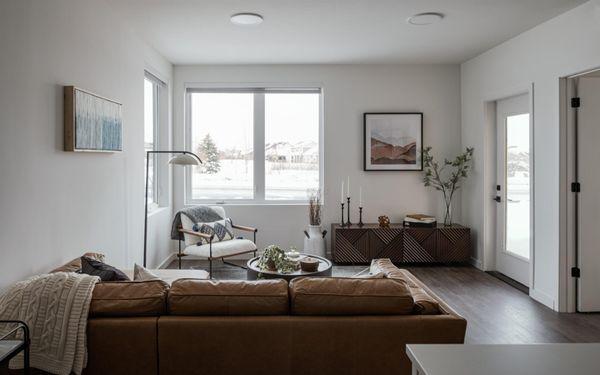 Open concept living room with luxury vinyl plank flooring and unobstructed mountain views.