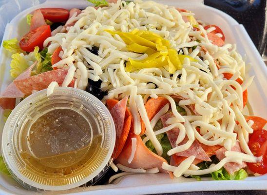 Large antipasta salad. Really fresh romaine under the goodies. Yummy dressing.