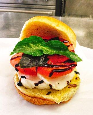 Caprese Sandwich: layers of buffalo mozzarella, vine-ripened tomatoes, basil and a balsamic drizzle