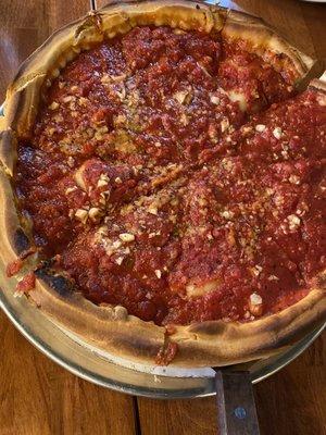 Medium Deep dish pizza with pepperoni, garlic, onion and peppers