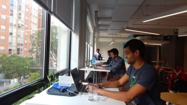 High tables overlooking 7th Street corridor.