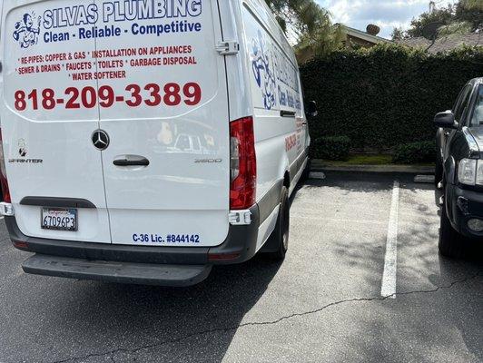 Parks in two spaces during lunch rush