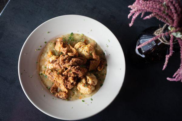 WEDNESDAYS Special: CHICKEN AND DUMPLINGS. Fried chicken thighs and biscuit dumplings drenched in a mirepoix gravy, topped with spicy honey.