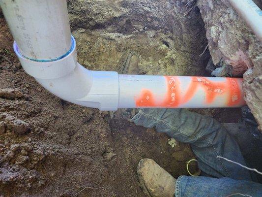 Installed new section of underground sewer line and marked the new pipe