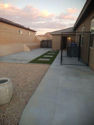 Artificial turf with inlaid steps: two pads 1 for future shed and dog kennel and 1 for small car parking space.