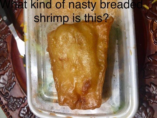 Greasy "breaded" fantail shrimp in layers of wonton wrappers.