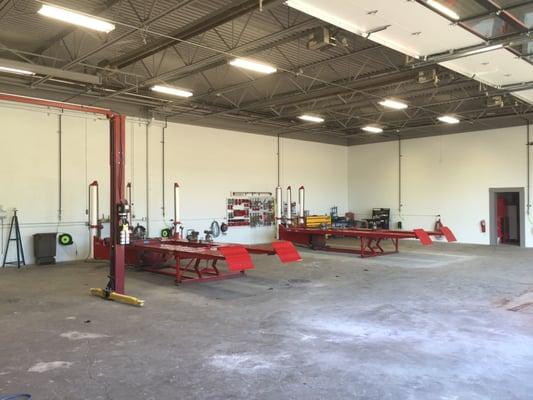 Our Bright and Clean Repair Shop, 2 Frame Racks, Hoist