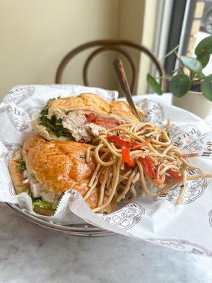 Chicken salad croissant and noodles