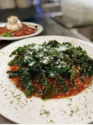 Mozzarella triangles special. Homemade marinara lightly breaded mozzarella topped with crispy spinach.