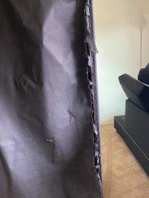 Torn bottom of couch