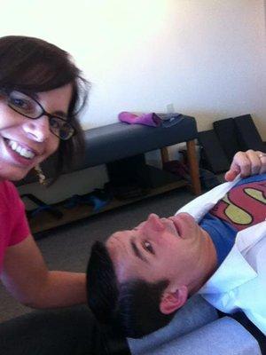 Dr. Kat helping superman with her super power.