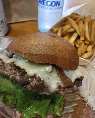 Venison Burger with Pepper Jack, fresh lettuce, Caramelized Onions, and spicy mustard with a side of handcut fries.