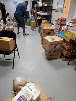 Stocking shelves, after receiving food items