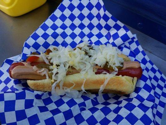 Audible with sauerkraut, garlic aioli, and jalapenos