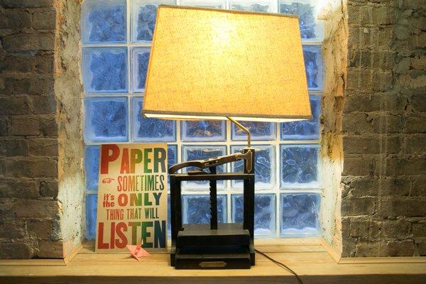 A lamp made out of an antique book press