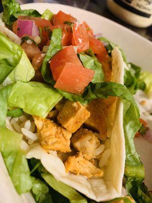 Chicken Taco cilantro rice with queso, pico, and lettuce.