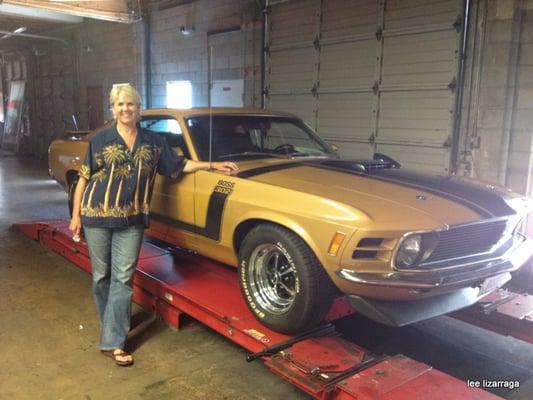 Lisa alongside one of clients vehicles.