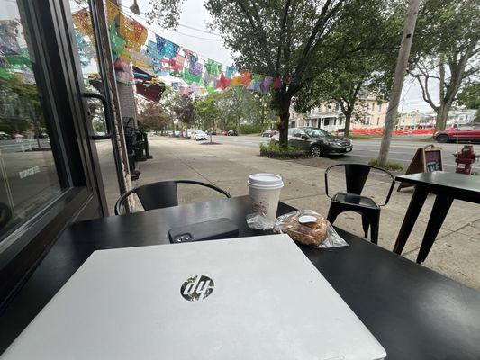 Enjoying the café's sidewalk seating.