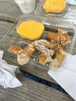 A pretzel with cheese (torn apart for my toddler)