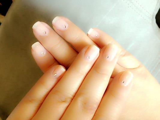 Natural pink manicure with polish and pink crystals