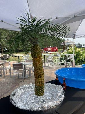 Pineapple palm tree decor (they ended up adding fruit to the base! So cute