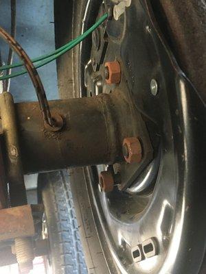 Loose nuts on brake assembly and wire ties not used