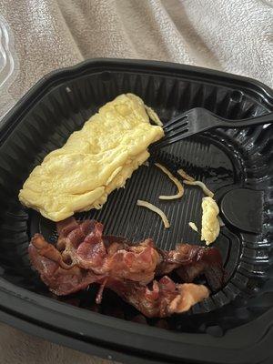 What was supposed to be a cheddar and bacon omelet with a fruit cup. Made it completely wrong and too lazy to do it right.