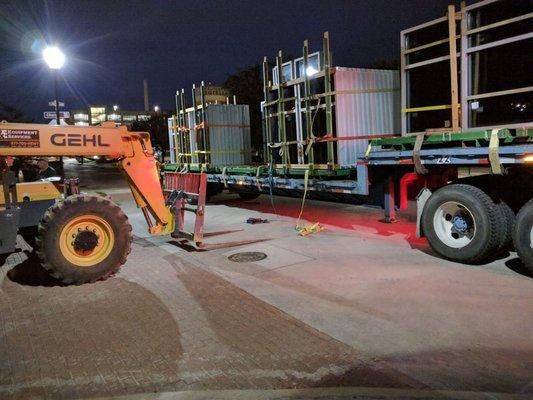 Truck ad fork lift illegally parked in the morning, blocking exits from the near adjacent parking lot.