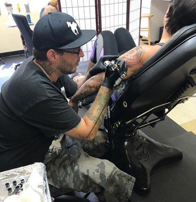 Doug doing some Tahitian  sleeve work on a regular client Instagram: tattoos_by_doug