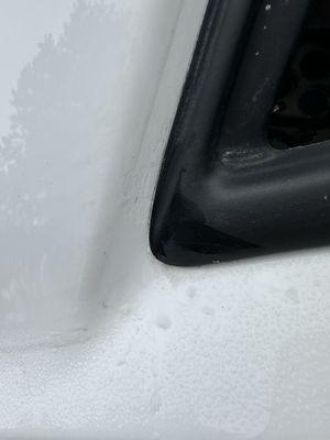 Paint build up in corner of back window