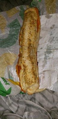 Subway what is this? Better watch who you hire cause theyre throwing food any kind of way!! And my wrapping was bs too!!