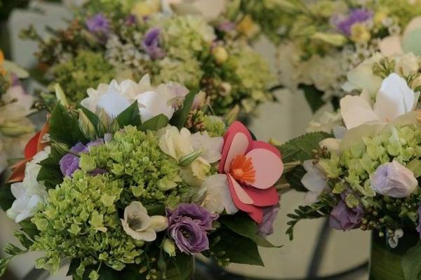 Table centerpieces by In Water Flowers incorporating handmade paper flowers