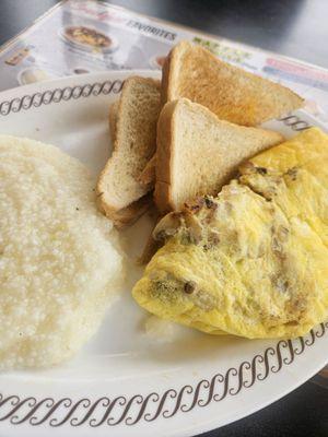 Veggie omelet with grits and toast