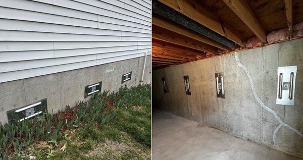 Plate anchors installed on an exterior garage wall and interior basement wall to stabilize the lateral movement of the walls.