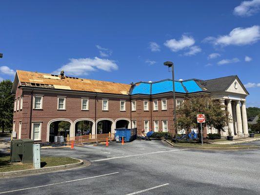 This building had an old roof that was past its prime! Due to leaks our team had to replace several damaged sheets of OSB.