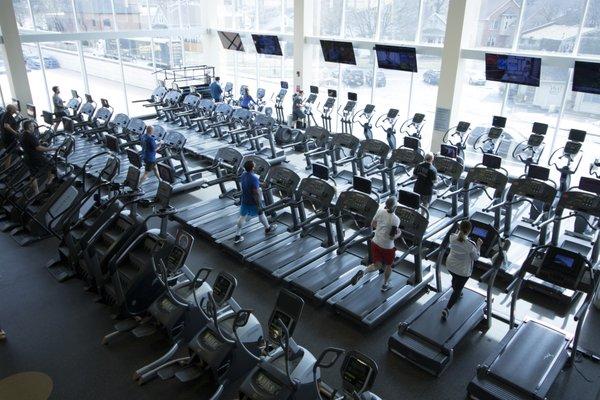 Shot of the first floor cardio area from the second floor mezzanine weight machine level.