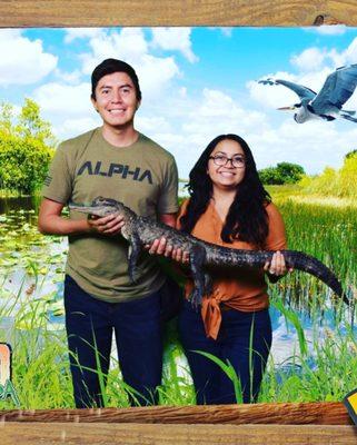 Holding a baby alligator