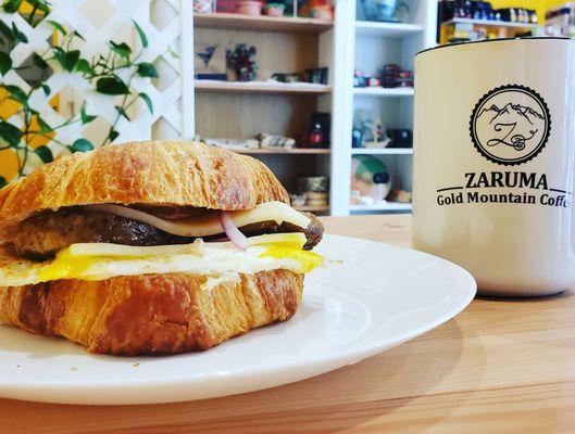 I'm drooling! Sausage, egg and cheese on a flaky croissant.