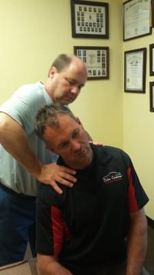 Dr, Frank Sitzmann adjusts a patient in his Sitzmann Chiropractic Clinic in Greenville SC...