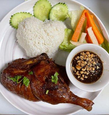 Honey roasted and crispy half duck rice platter with healthy vegetables and accompanied by delicious homemade sauce with pickle (R5).