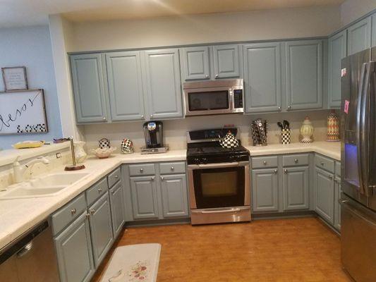 After photo of kitchen cabinets with a custom color lacquer finish.