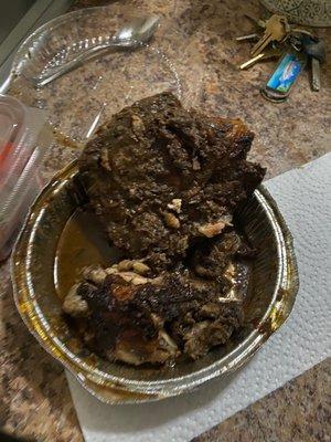 The 2 pieces of jerk chicken I received when I ordered a LARGE jerk chicken without sides for $15.00