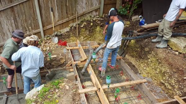 Robert's son running line pump filling my footing forms.