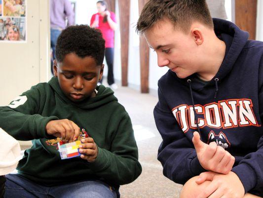 Middle school students participate in leadership and mentoring programs.