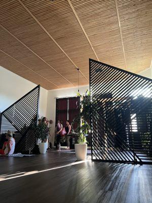 The inside of the Yoga studio, love the wooden entrance borders