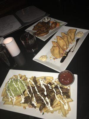 Steak fries, chicken empanadas, and wings