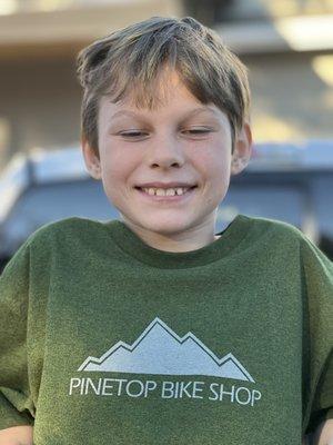 My boy! Not only did he get an awesome bike but he got the T--shirt too!