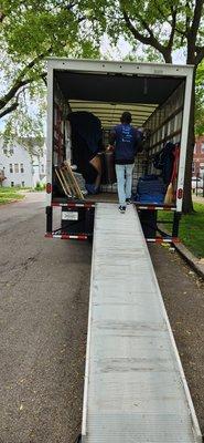 A crew member assisting with the load.